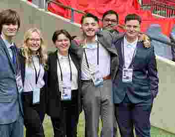 Students work pitchside at National League Play-Off Final at Wembley