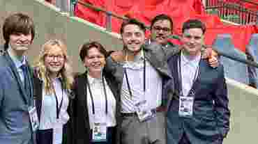 Students work pitchside at National League Play-Off Final at Wembley